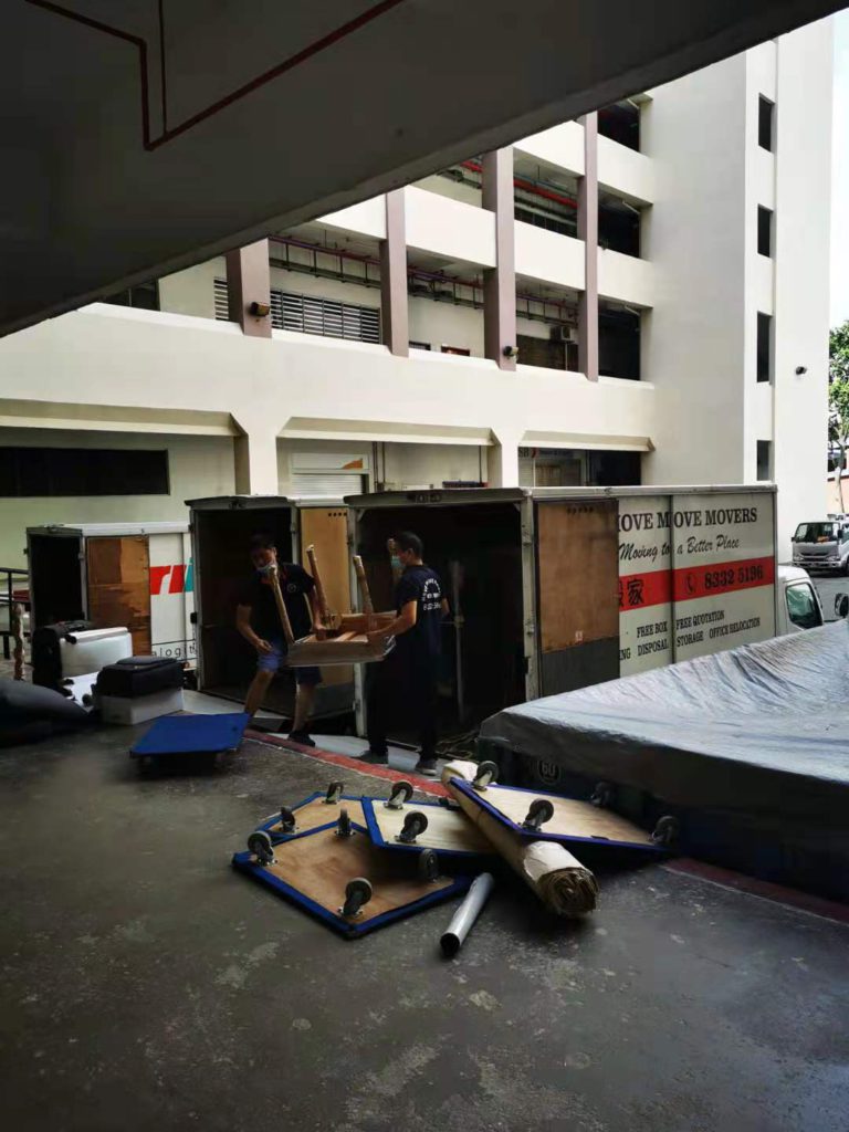 Move Move Movers crew loading office furniture into a branded truck during an office relocation at Science Park