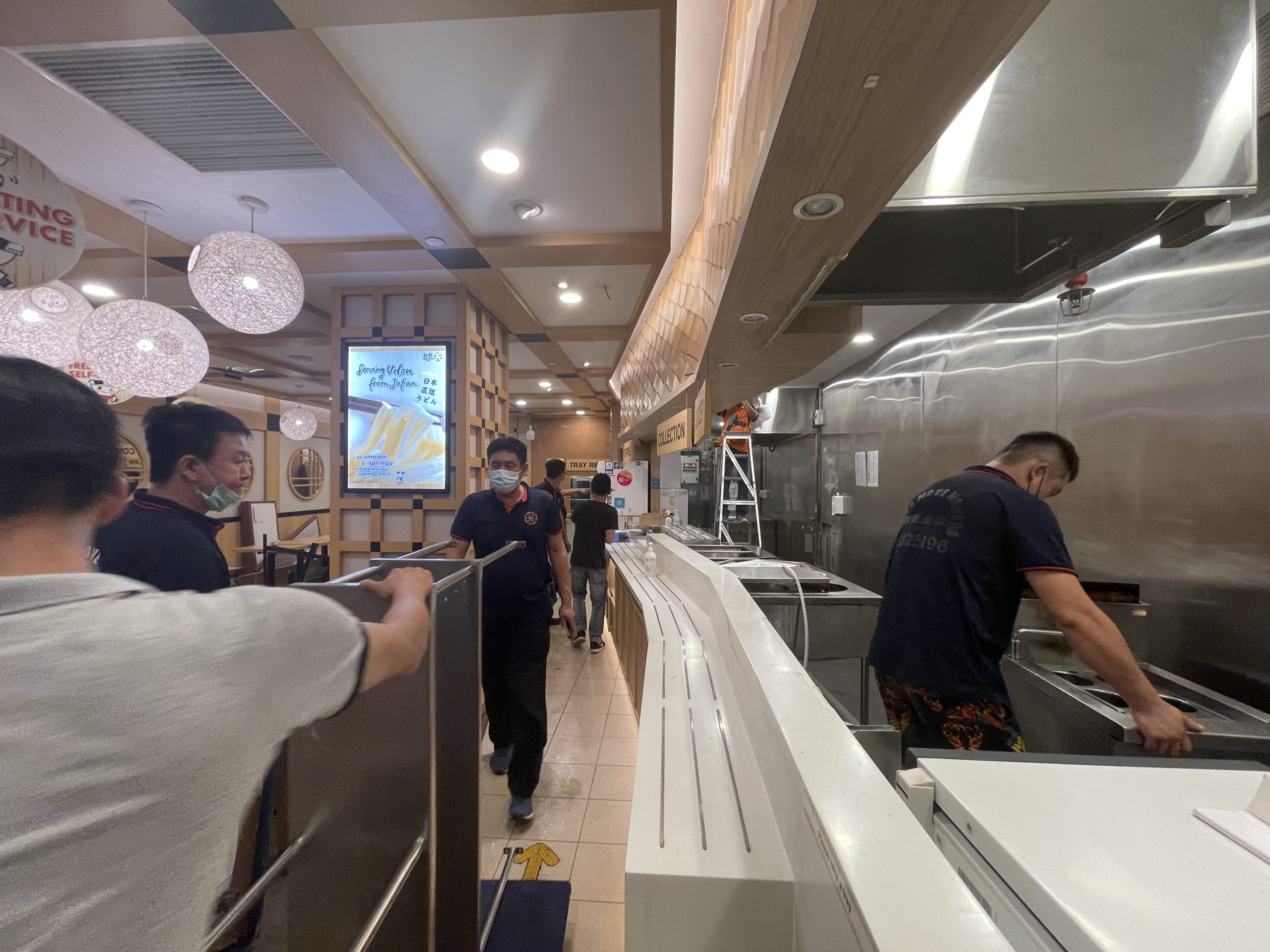 Retail shop relocation in singapore - move move movers – move move movers – move move movers Move Move Movers crew preparing a retail shop relocation inside a Singapore shopping mall