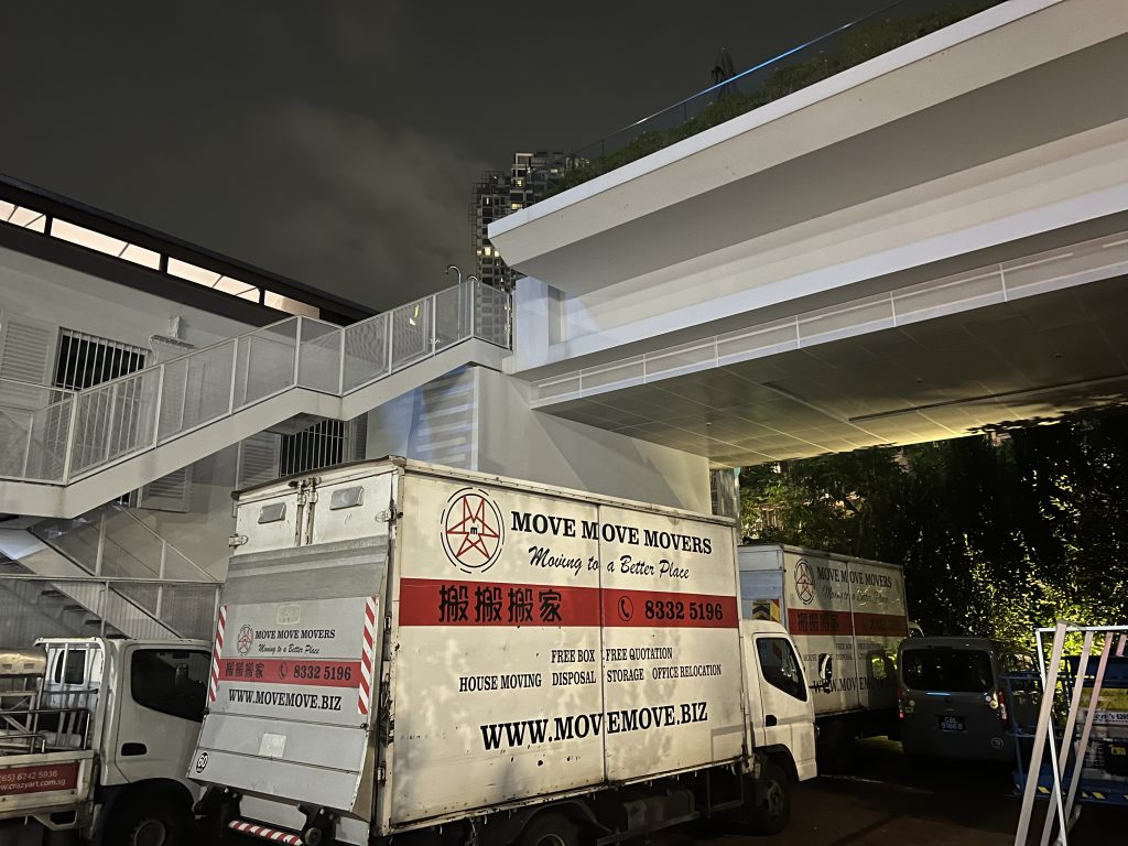 Move Move Movers lorries staged for after-hours access at The Warehouse Hotel in Singapore