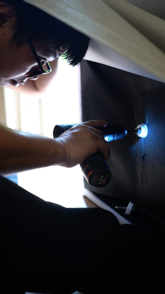 Furniture dismantling with power tools – move move movers – move move movers Technician using a power tool to dismantle furniture before moving
