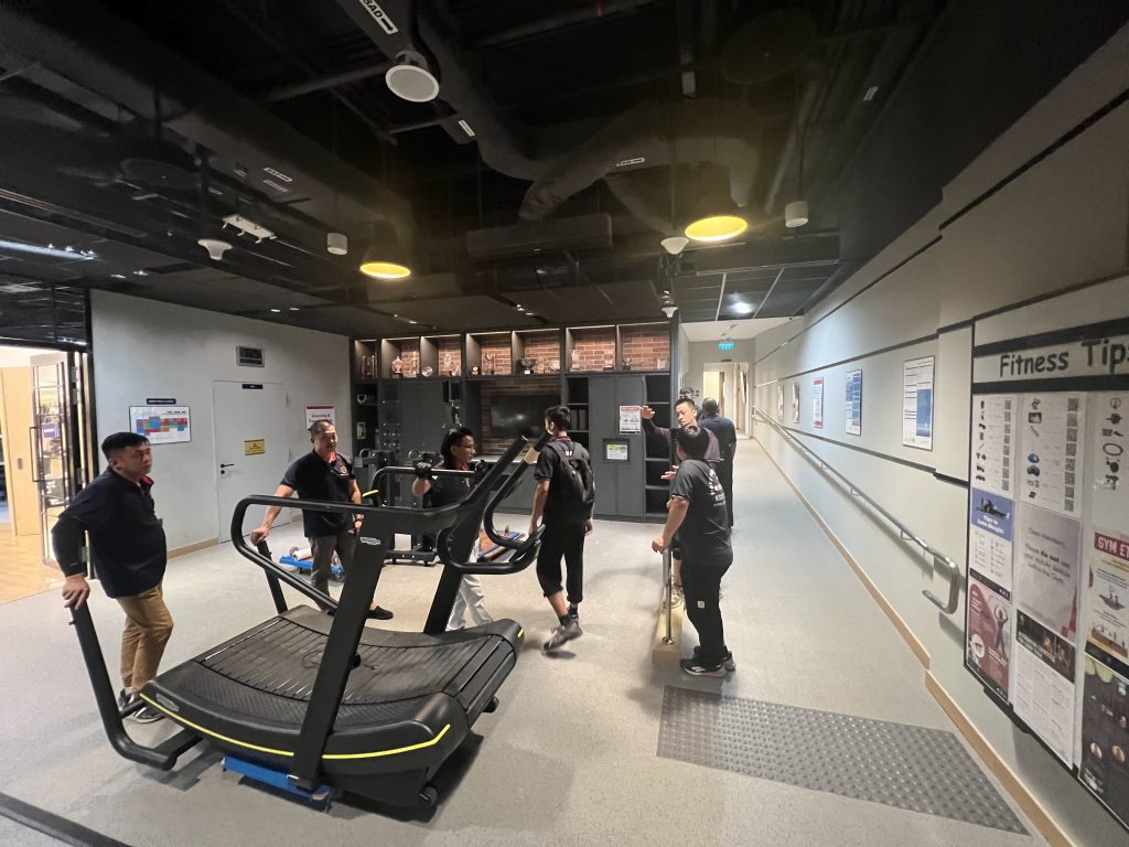 Commercial gym equipment positioning in singapore – move move movers – move move movers Move Move Movers crew positioning commercial gym equipment inside a Singapore fitness facility