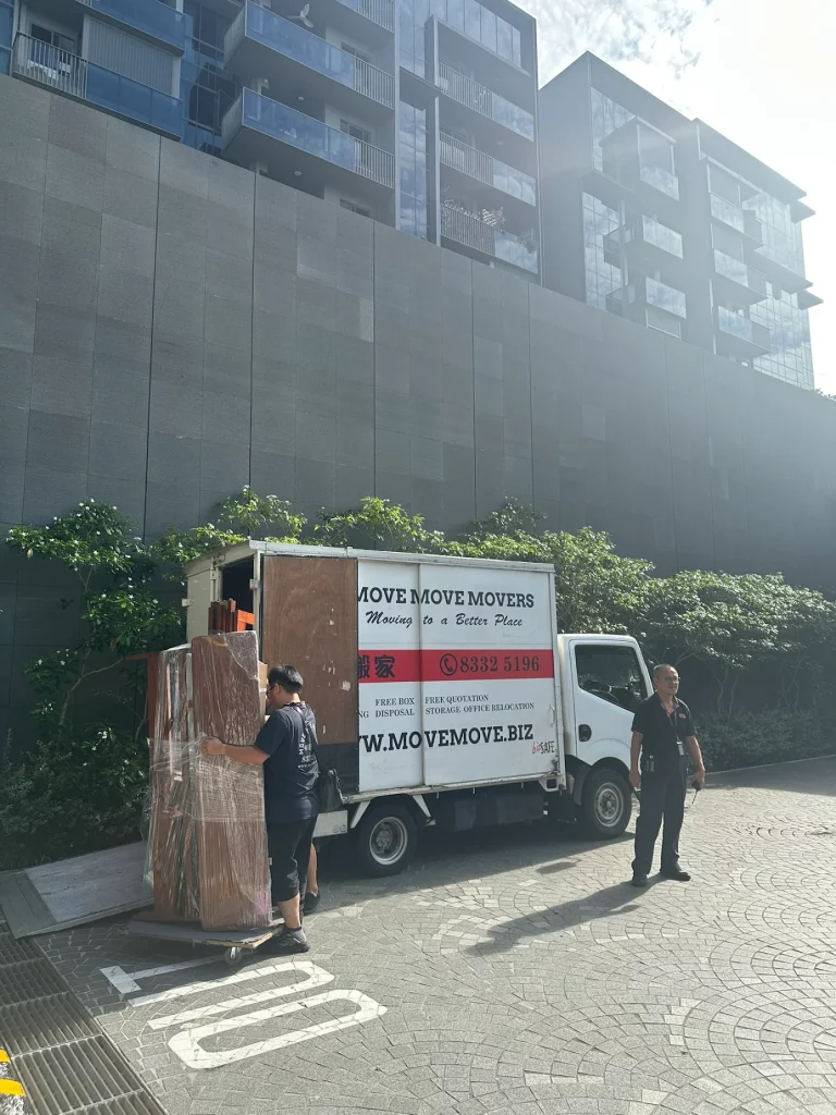 Condo unloading with moving lorry – move move movers – move move movers Move Move Movers lorry unloading wrapped furniture outside a condominium in Singapore