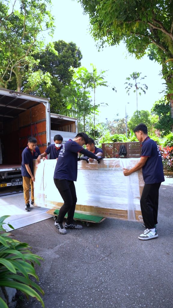 Move Move Movers vehicle and crew at a residential or commercial moving site in Singapore