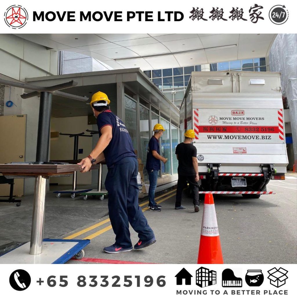 Move Move Movers branded lorry and crew handling commercial moving items in Singapore