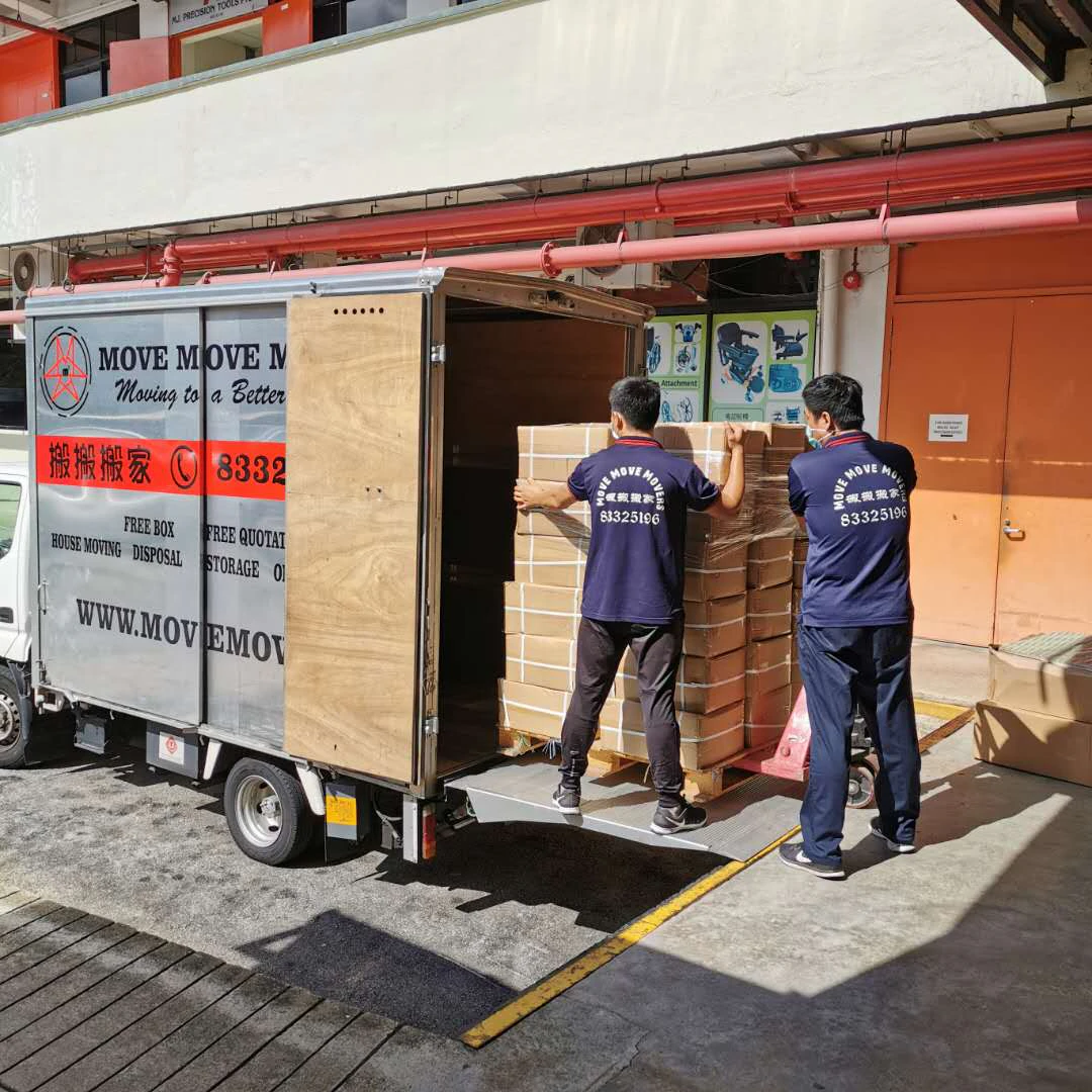 Move Move crew loading a wrapped cabinet into a lorry